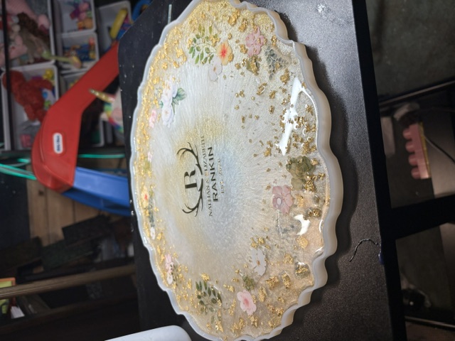 Side view of a cream wedding bowl curing in its mold