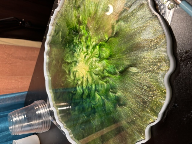 Green and gold wedding bowl curing in its mold